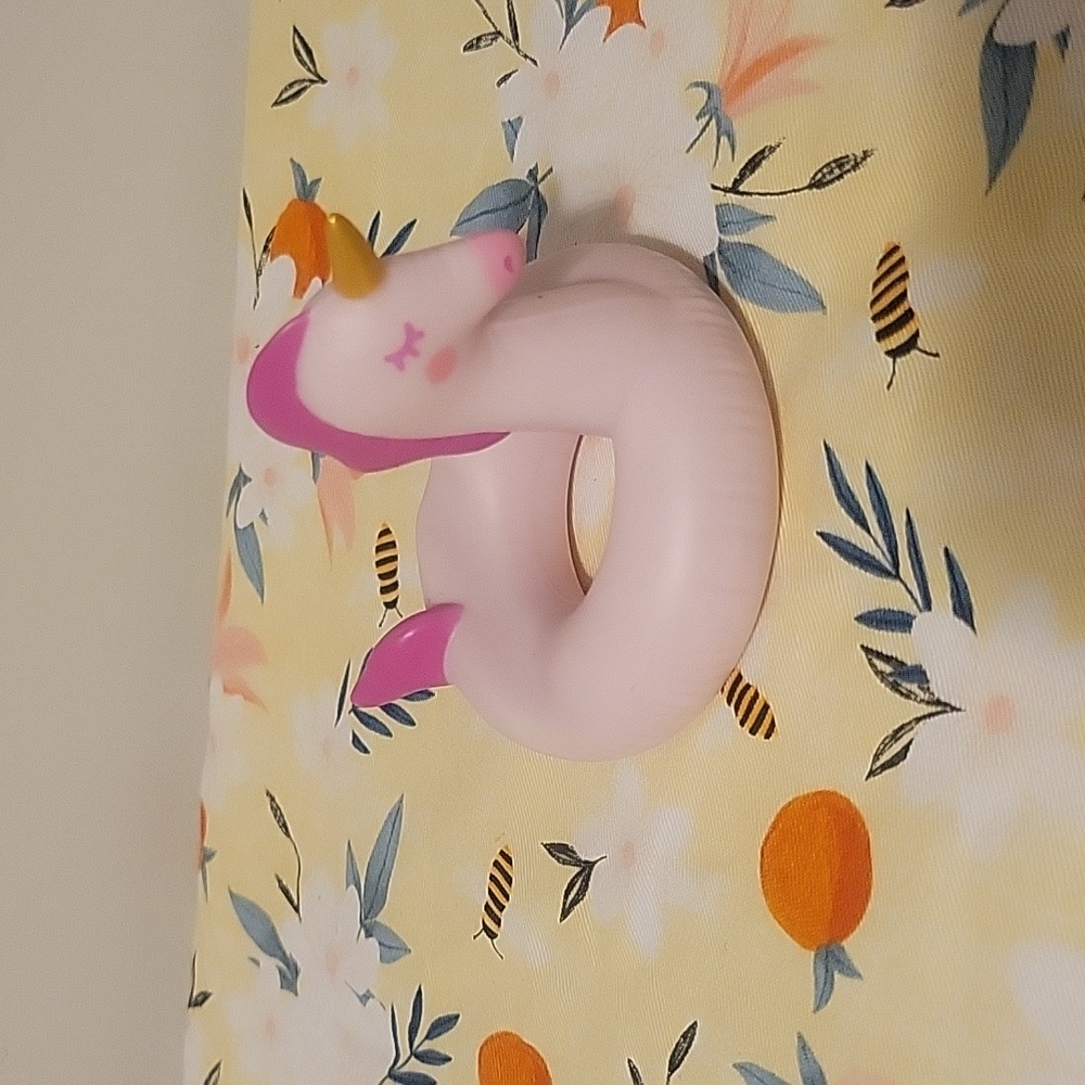 Unicorn phone holder, solid plastic looks like a pool floatie